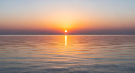 Beautiful sunset over the sea. The sun is reflected in the water.の写真素材