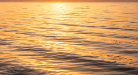 Sunset on the sea. The sun is reflected in the water.の写真素材