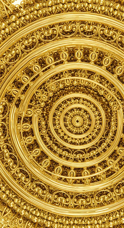 golden pattern on the wall in temple, closeup of photoの写真素材