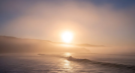 Beautiful sunrise over the sea with fog in the foreground, long exposureの写真素材