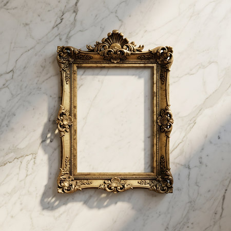 blank golden frame on white marble wall, vintage filtered and tonedの写真素材
