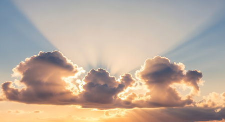 Sunset sky background with clouds and rays of light. Nature composition.