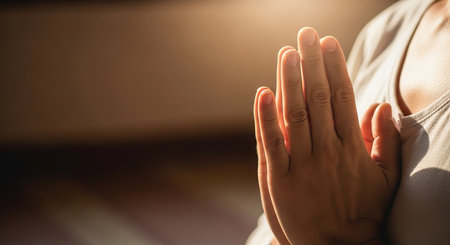 Closeup of woman hands in prayer position. Focus on hands.