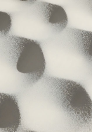 abstract background of a white wall with holes in the form of circlesの写真素材