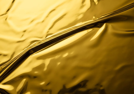 abstract gold background texture with some smooth lines in it and some foldsの写真素材