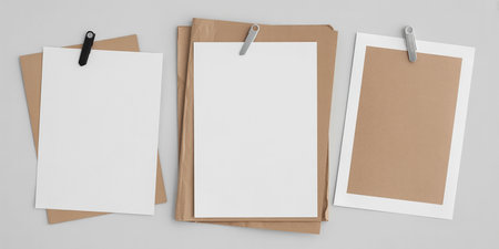 Blank paper sheets with clip on white background. 3D renderingの写真素材