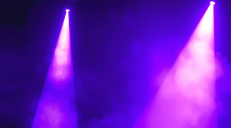 Purple stage lights in a nightclub with smoke and rays of lightの写真素材