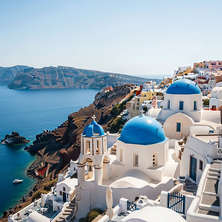 Oia village on Santorini island, Greece. Beautiful summer landscape with blue domes and sea.の写真素材