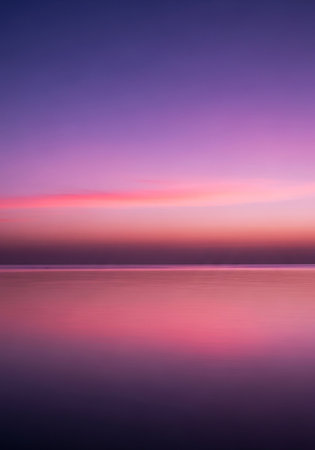 Beautiful sunset over the sea. Long exposure photo. Toned.の写真素材