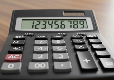 Calculator with digital display on wooden table, closeup viewの写真素材