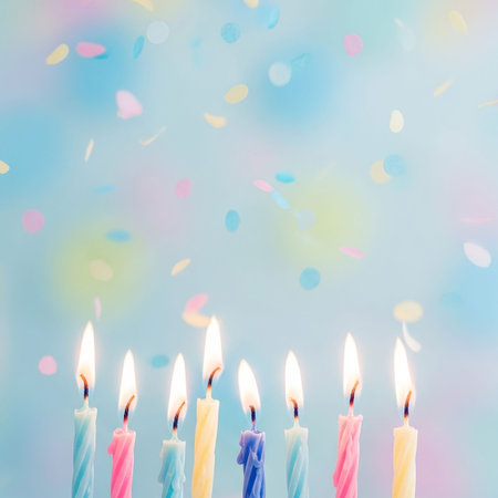 Birthday candles and confetti on a blue background. Copy space.の写真素材
