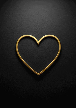 Gold heart on a black background. Valentine's day. Copy space.の写真素材