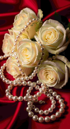 wedding bouquet of roses and pearls on red backgroundの写真素材