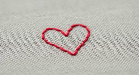 Red heart embroidery on linen fabric background. Valentine's day conceptの写真素材