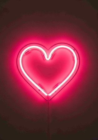 Neon heart on a dark background. Valentine's day background.の写真素材