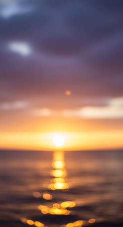 Defocused sunset over the sea. Bokeh background. Abstract nature background.の写真素材