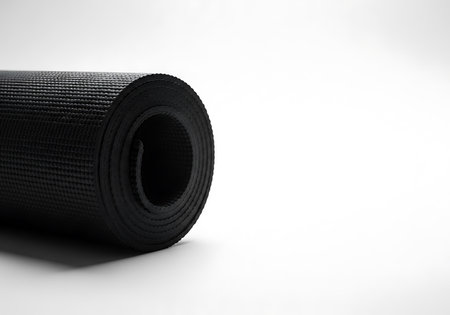 Roll of black yoga mat on white background. 3d illustration.の写真素材
