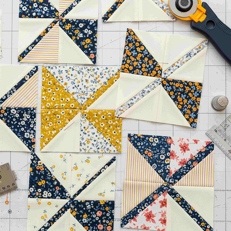 Patchwork quilt on the background of a ruler and measuring tape