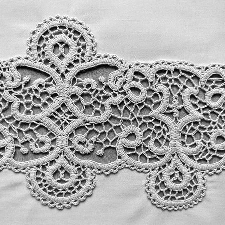 Lace on fabric texture. Lace pattern on fabric background.