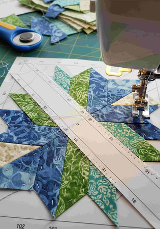 Sewing machine and fabric with different patterns, close-up