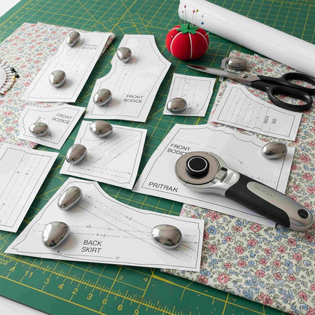 Sewing tools on the green cutting mat.