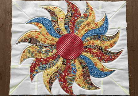 Fabric of the sun on a wooden background. Handmade.
