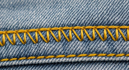 Closeup of a zipper on blue jeans. Textured background.の写真素材