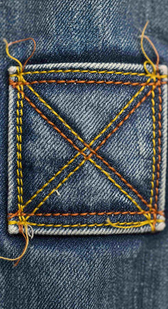 Jeans texture with stitches and seams, close-up. Denim background