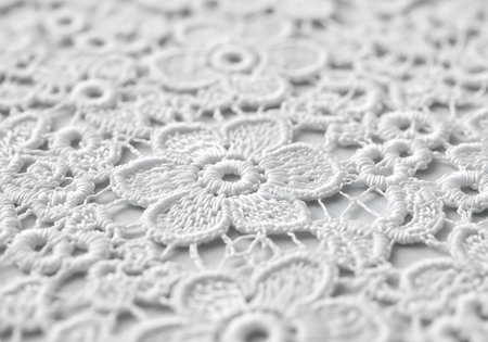 Close up of white crochet doily on white background. Copy space.の写真素材
