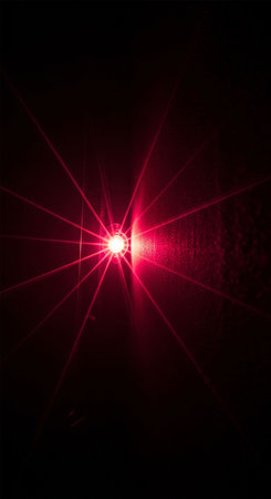 Red light beam on black background. Abstract background for your design.の写真素材