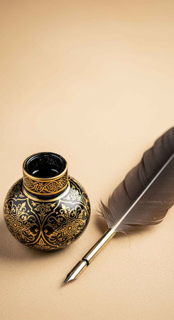 feather and inkwell on a beige background. tinting. selective focus