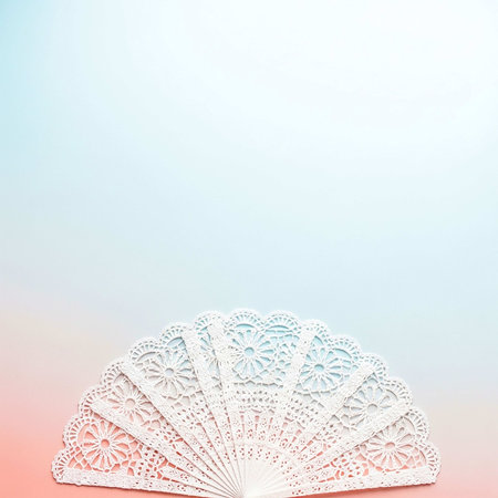White paper fan on pastel background. Copy space for text.の写真素材