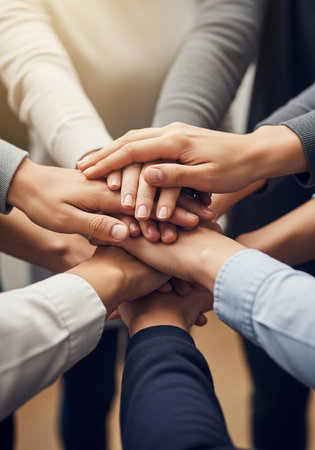 Teamwork concept. Close up of a group of people holding hands together