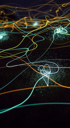 abstract background with neon lines and bokeh defocused lightsの写真素材