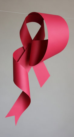 Red ribbon on gray backgroundの写真素材