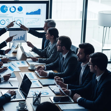 Group of business people working together in office. They are sitting at the table and discussing financial charts.の写真素材