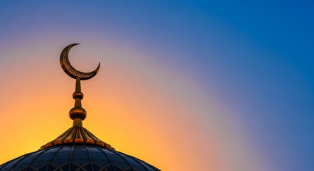 Silhouette of a mosque at sunset, Ramadan Kareem backgroundの写真素材