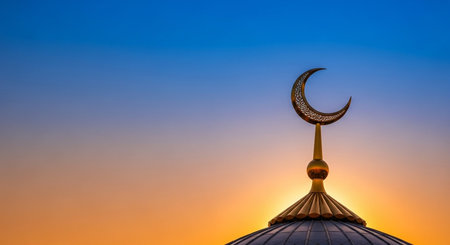 Mosque with crescent moon at sunset, Ramadan Kareem backgroundの写真素材