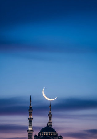 Mosque and the moon at sunset. Ramadan Kareem background.の写真素材
