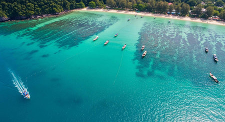 Aerial view of tropical beach with boats and blue sea in Krabi, Thailandの写真素材