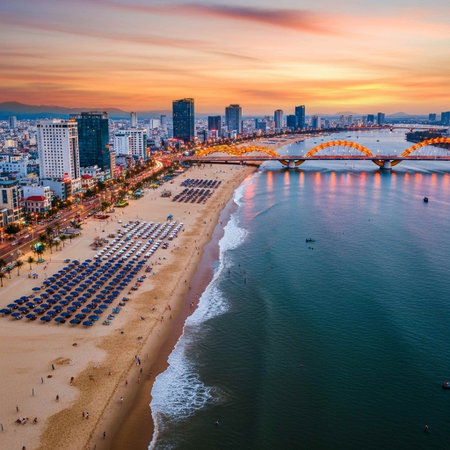 Aerial view of a beach with a city skyline at sunsetの写真素材