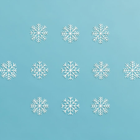 Snowflakes pattern on blue background. Minimal winter concept.の写真素材