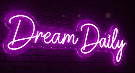 Neon sign with text Dream Big on a brick wall background.の写真素材