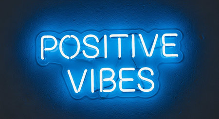 Positive vibes neon sign on blue wall. 3D renderingの写真素材