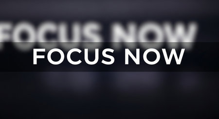 FOCUS NOW written on a black background with a glitch effectの写真素材
