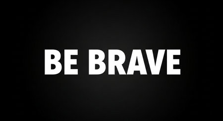 Be brave. Black and white lettering on a black background.の写真素材