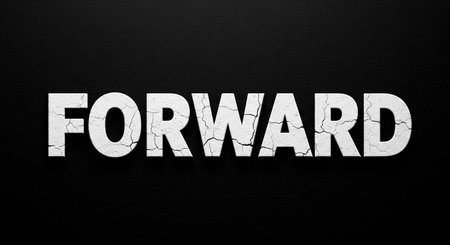 The word forward is written in white paint on a dark background.の写真素材