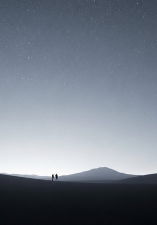 Silhouette of a couple standing in the middle of the desert and looking at the starry skyの写真素材