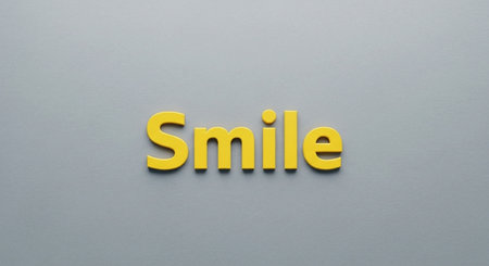 Word Smile made of yellow plastic letters on gray background, 3d renderの写真素材