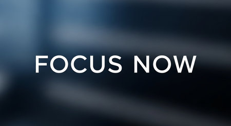 FOCUS NOW text on blurred background. Business and technology concept.の写真素材